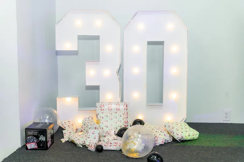 Marquee light-up numbers with gifts and warm glow