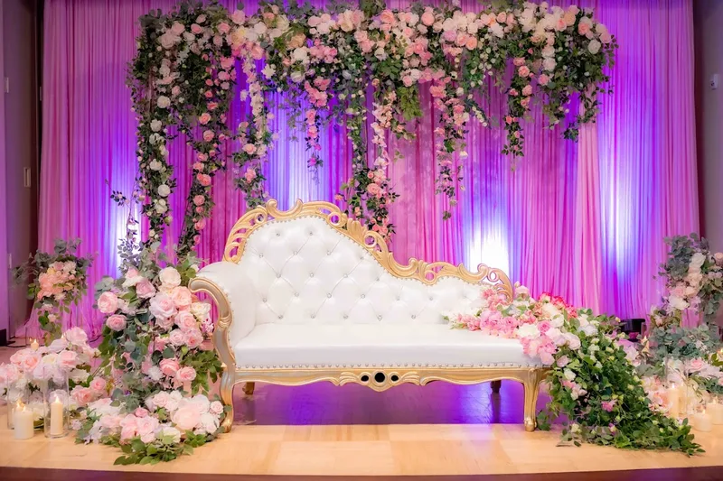 Luxury gold chaise with cascading floral installation