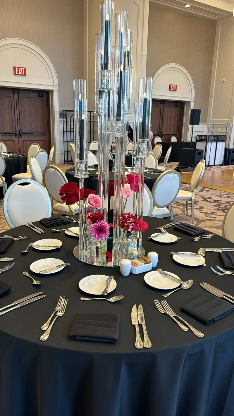 Elegant black linen wedding table with crystal candelabra at DFW venue